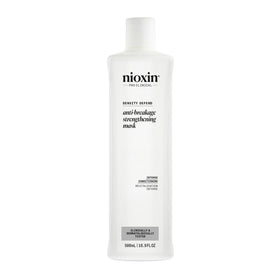 Nioxin Density Defend bottle pour showing easy application for strong hair