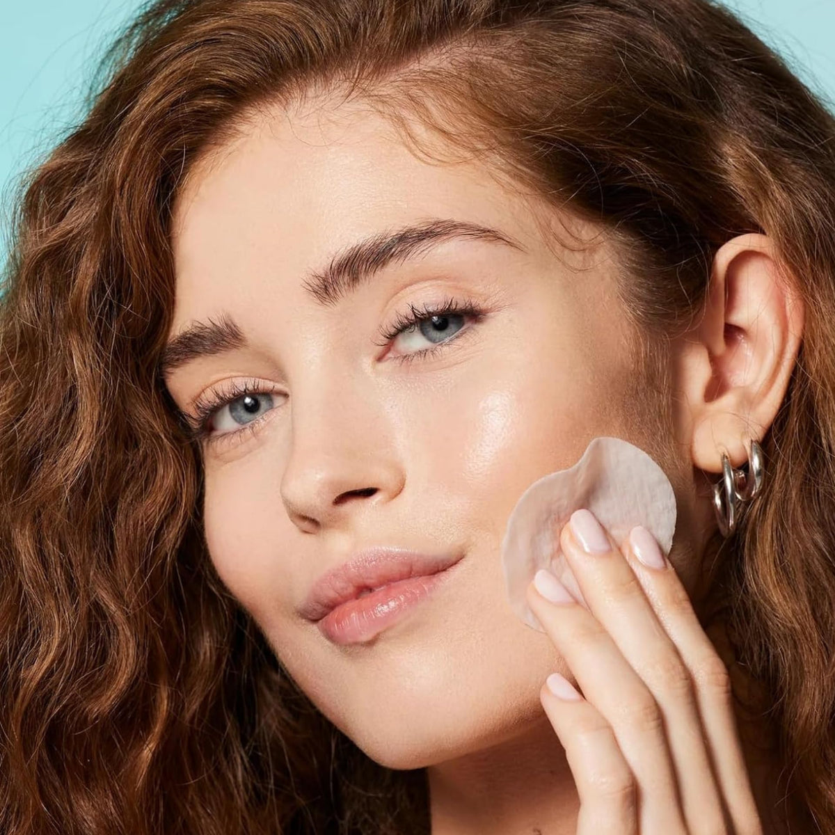 Pad on face close-up from Nip + Fab Glycolic Fix Night Pads Extreme XXL showing exfoliation