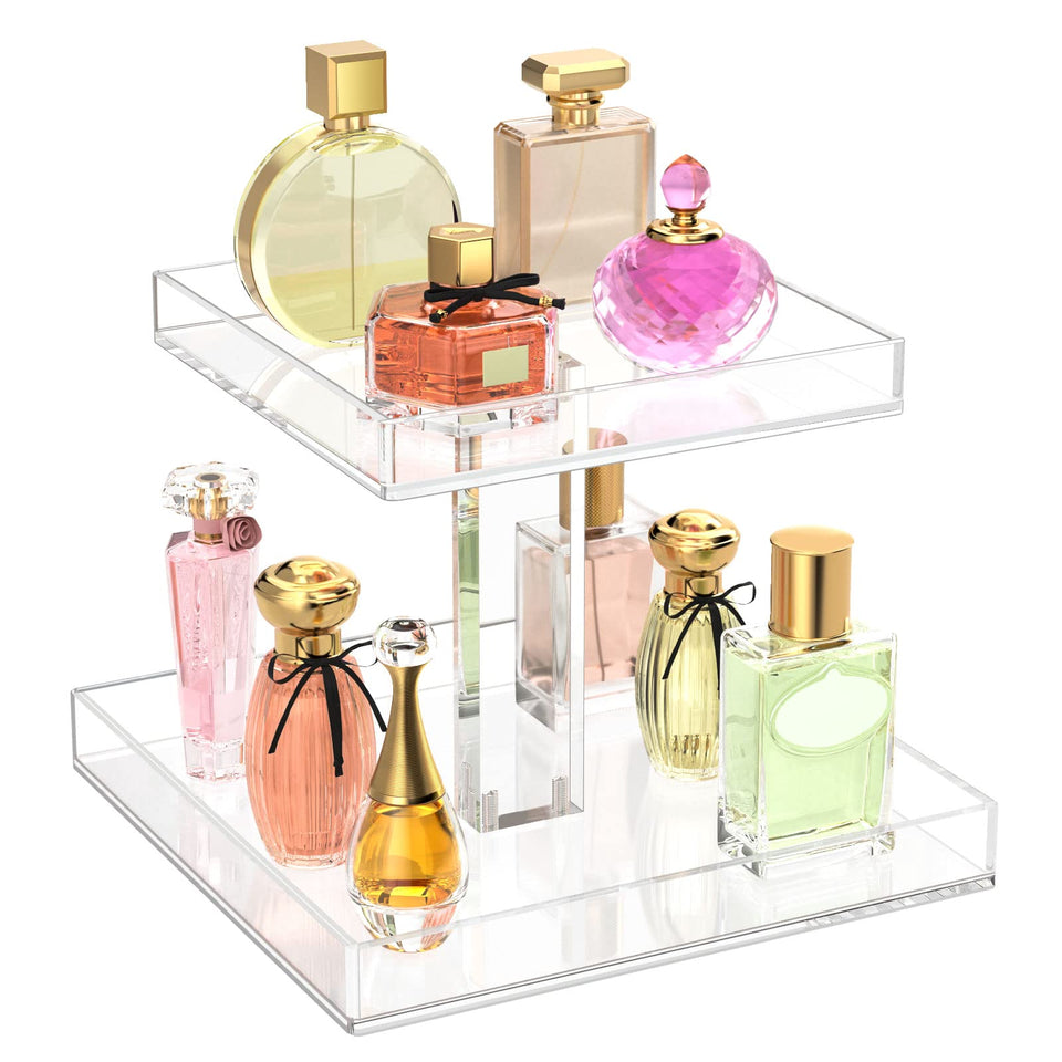 NIUBEE two-tier acrylic storage tray keeps perfume bottles neatly organized on the dresser.