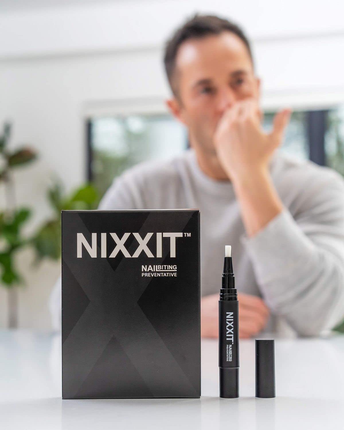 NIXXIT Nail Biting Pen dries clear after application for discreet use.