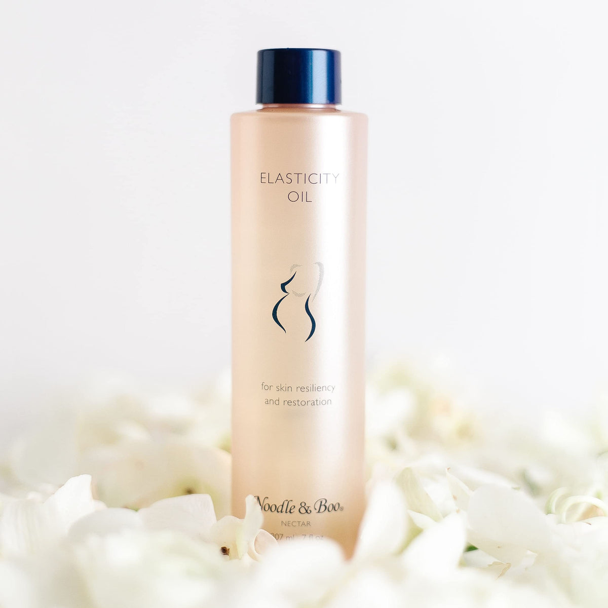 Noodle & Boo Elasticity Oil on belly during application promotes smooth stretch
