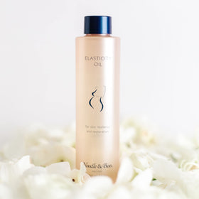 Noodle & Boo Elasticity Oil on belly during application promotes smooth stretch