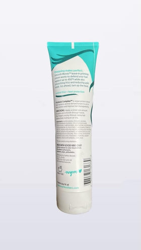 Not Your Mother's Smooth Moves Priming Cream label closeup highlights frizz protection and nourishing oils.