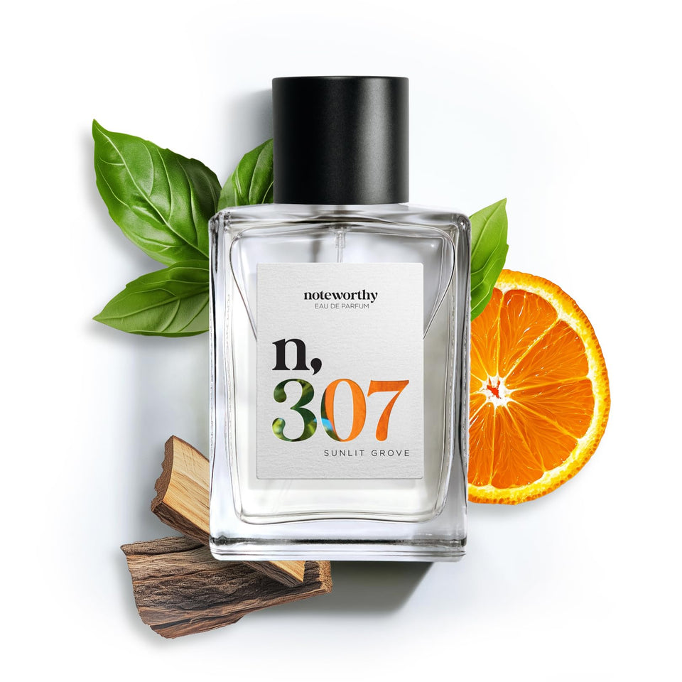 Noteworthy n,307 Sunlit Grove bottle with warm mandarin and sandalwood for everyday luxury.