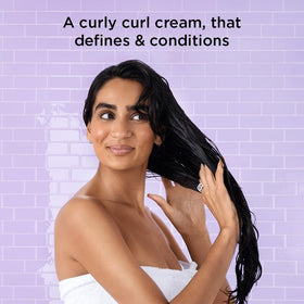 Noughty Wave Hello Curl Cream being applied to damp hair for frizz control