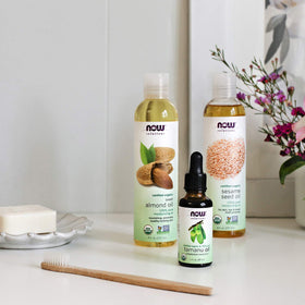 NOW Foods Organic Sweet Almond Oil certification stamp showcases organic and non-GMO status.