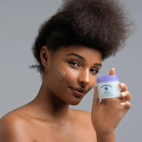 Nu Skin ThirstFix applied to cheek demonstrating cooling sensation.