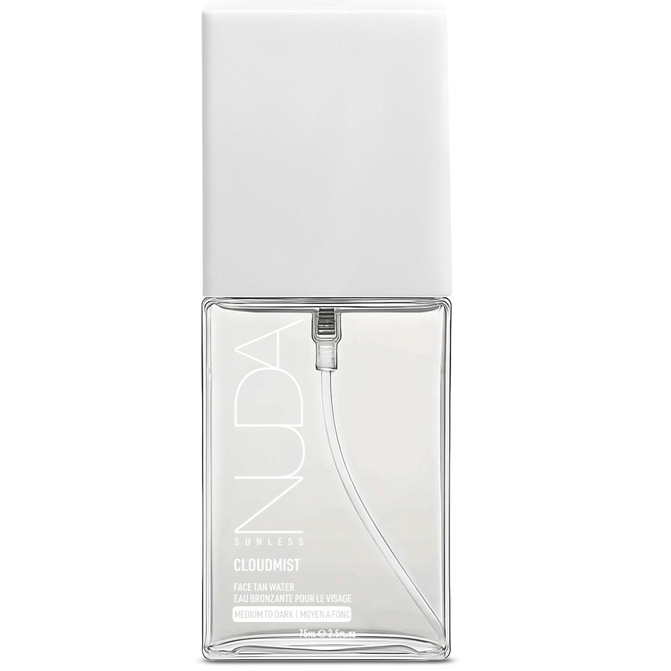 Nuda CloudMist bottle spray applying buildable glow to fair-to-medium skin.