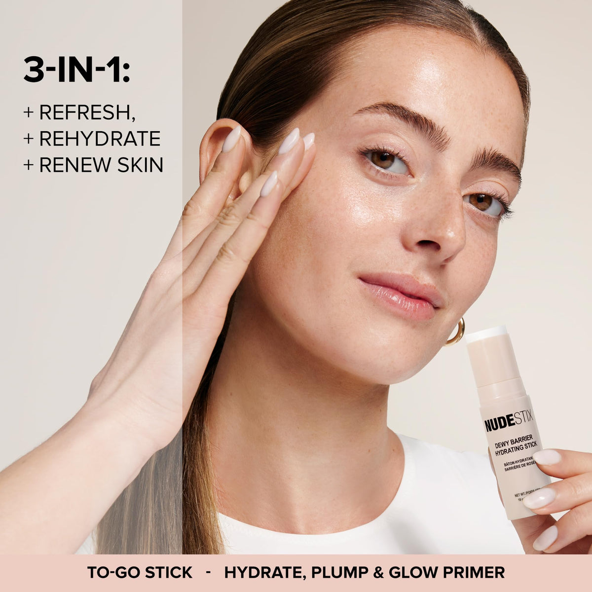 NUDESTIX Dewy Barrier applied to cheeks for a dewy, plump look