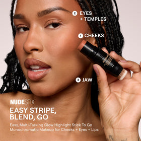 Nudestix Nudies Bronze Stick applied to eyelids for a subtle bronze glow.