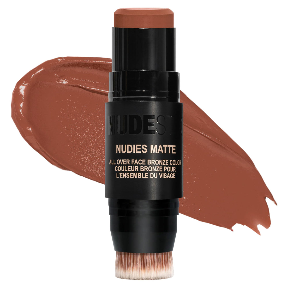 Nudestix Nudies Bronze Stick in a compact tin with color block and built-in brush.
