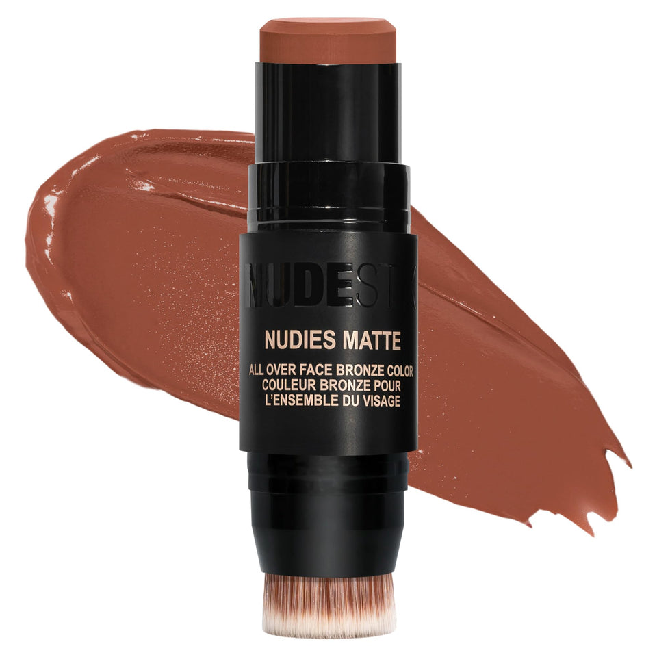 Nudestix Nudies Bronze Stick in a compact tin with color block and built-in brush.