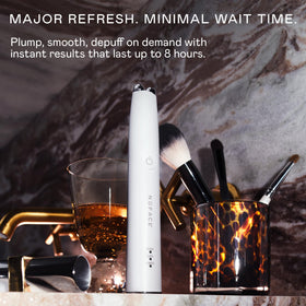 NuFACE FIX MicroWand in hand for portable use and control.