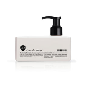 Close-up of Number 4 Hydrating Shampoo bottle highlighting color-safe formula.