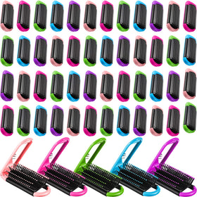 Nuogo travel brush in purple with mirror for on-the-go styling