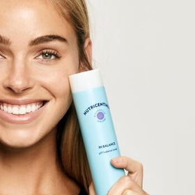 Applying Balance Toner on face after cleansing for soothing prep.
