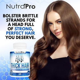 NutraPro Thick Hair Growth Vitamins capsules close-up showing easy-to-swallow daily supplement.