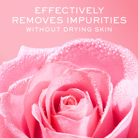 Nuxe Very Rose cleansing foam bottle on vanity conveys spa-like ritual ambience.