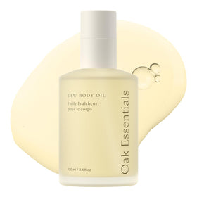 Oak Essentials Dew Body Oil bottle closeup highlights hydrating formula for dry skin.