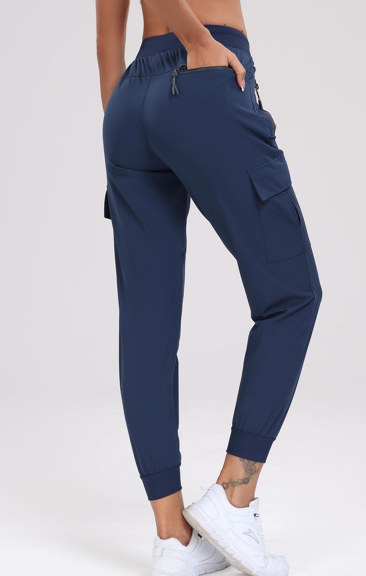 Oalka cargo hiking pants pocket closeup highlighting deep front zip pockets for quick access.