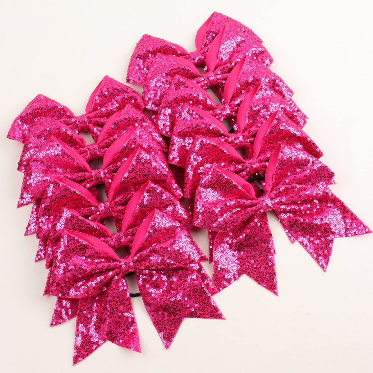 OAOLEER 12-pack bows on display in pink, budget-friendly option for teams and gifts