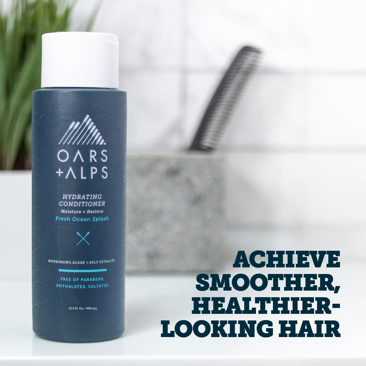 Oars + Alps Hydrating Conditioner label close-up highlights sulfate-free formula for smoother strands.