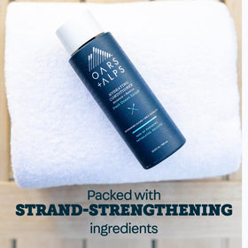 Oars + Alps Hydrating Conditioner ocean-scent scene, conveys fresh sea-inspired fragrance.