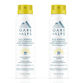 Oars + Alps mineral sunscreen spray bottle ready for quick sun protection on the go.