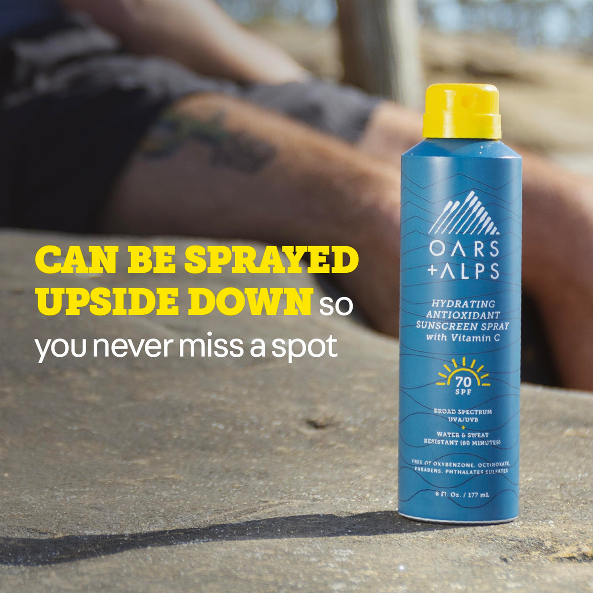 Oars + Alps SPF 70 sunscreen on beach scene highlights water resistance.