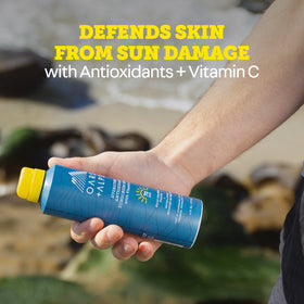 Oars + Alps reef-safe sunscreen spray with non-greasy feel on skin.