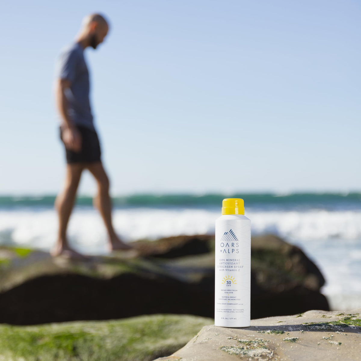 Oars + Alps sunscreen spray texture close-up demonstrates fast rub-in and clear finish.