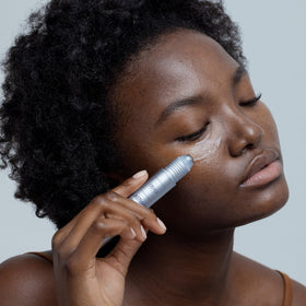 Close-up of Obagi ELASTIderm serum texture absorbing into skin