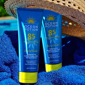 Ocean Potion SPF 85 bottle highlighting Aloe and Cocoa Butter for skin nourishment.