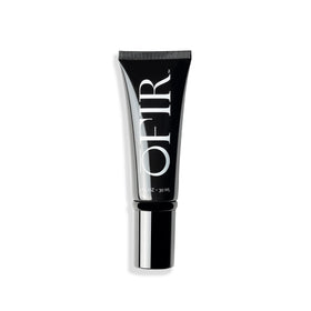 OFIR Skin Prep Dewy Primer Serum bottle glows with hydrating luminosity for makeup prep.
