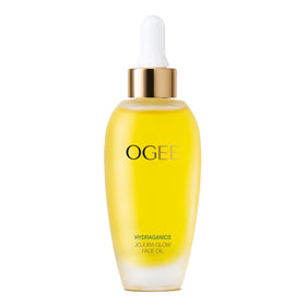 Ogee Jojoba Glow Face Oil bottle on a vanity, showcasing organic hydration for daily radiance.