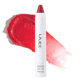 ogee petunia tinted lip oil bottle with sheer blush color for daily hydration