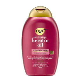 OGX Keratin Oil Conditioner pump close-up for easy daily use