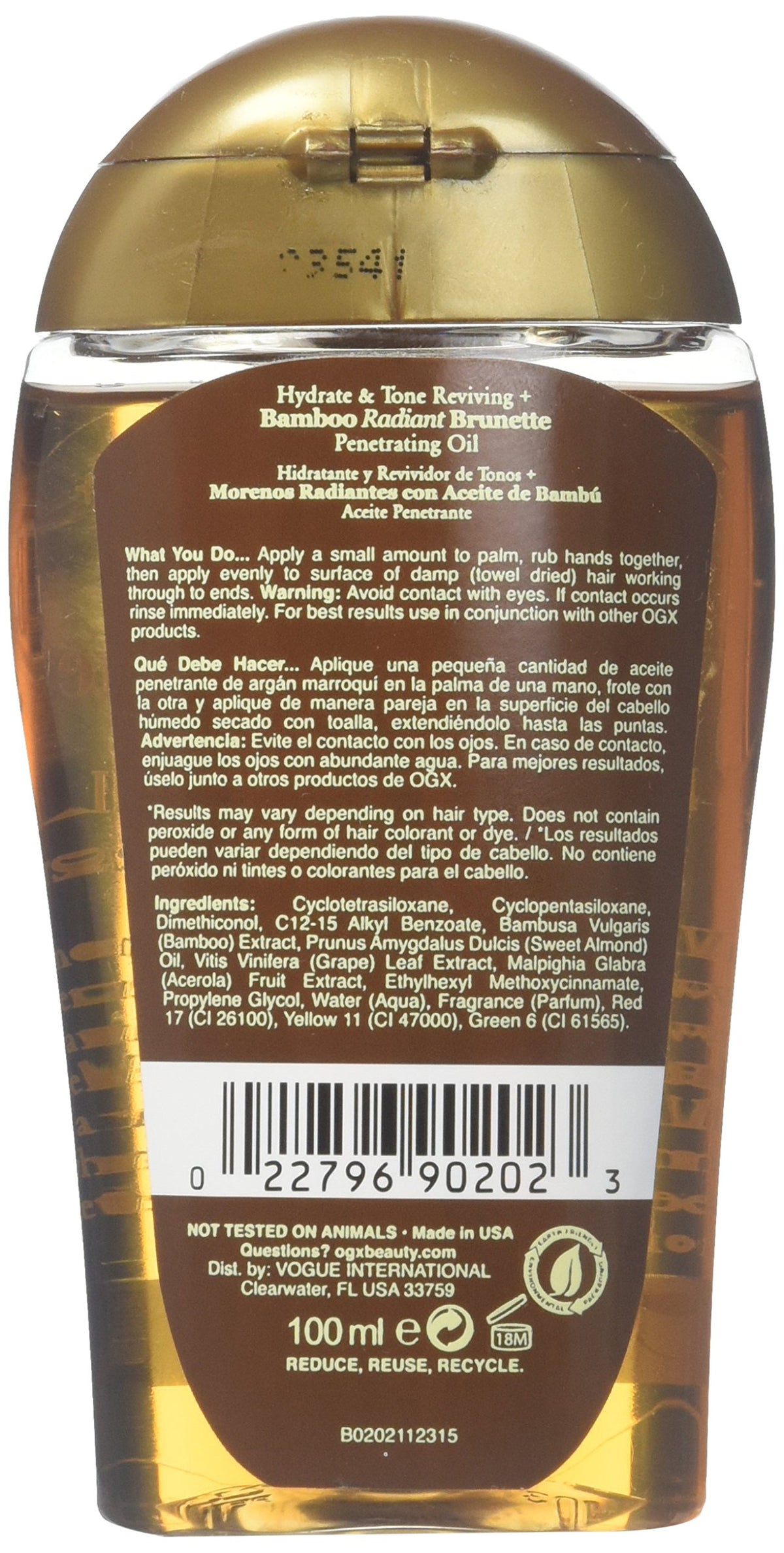 OGX bamboo extract application on brunette strands for luminous tone and moisture.
