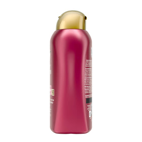 OGX Anti-Frizz conditioner foaming to smooth strands