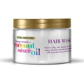 OGX Damage Remedy mask bottle highlighting nourishing formula for thick hair