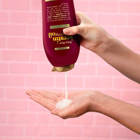 Hydrated, shiny hair after using OGX Frizz-Free Keratin Shampoo.