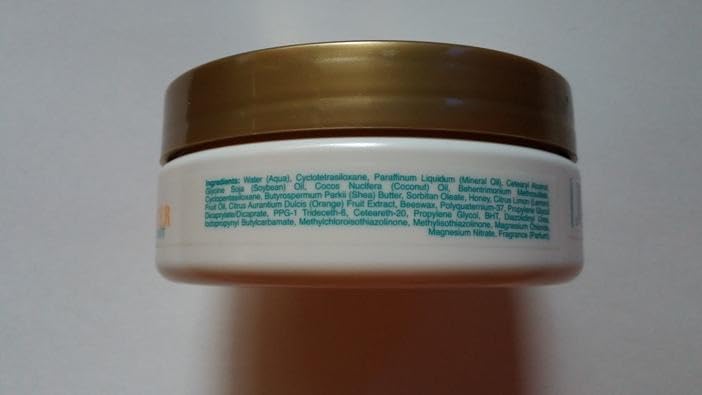 OGX Quenching Coconut Curls Butter curl definition display for frizz control