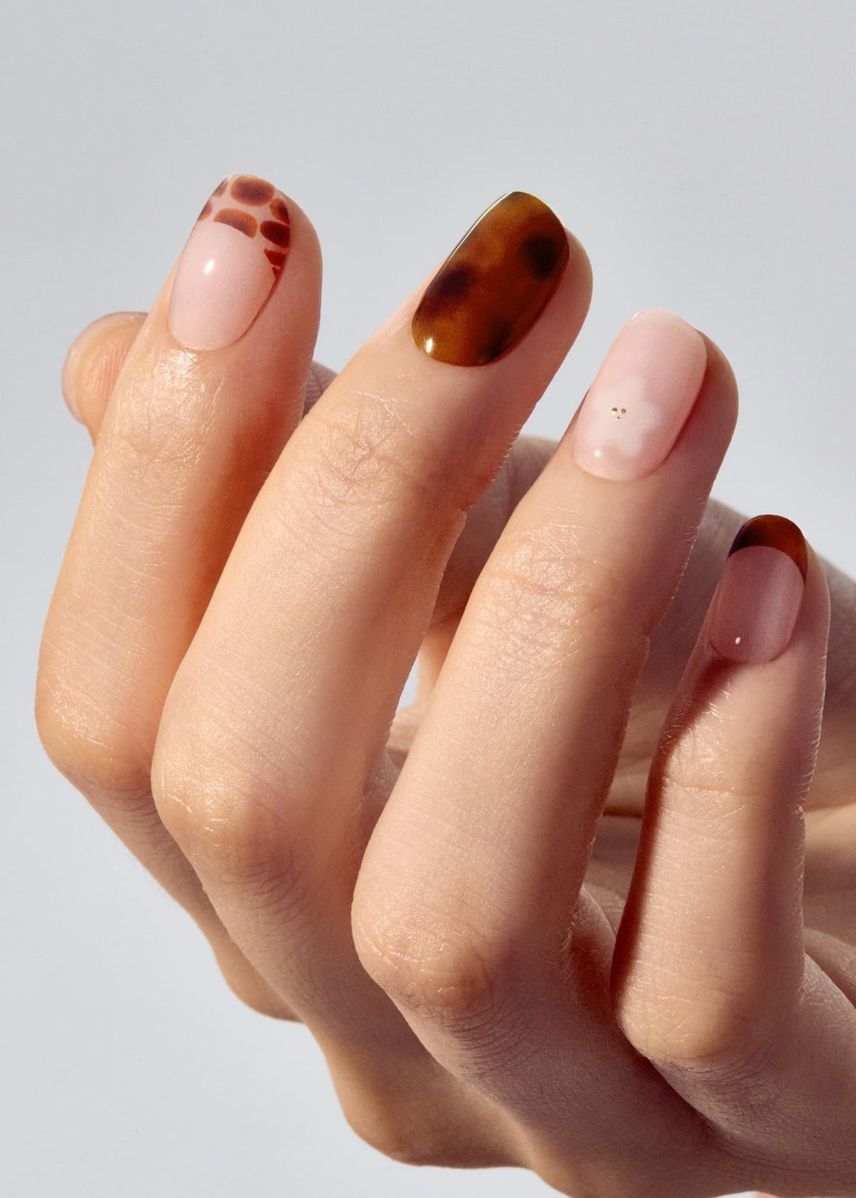 ohora N Tiki Tortoise nail strips application scene shows easy peel-and-stick.