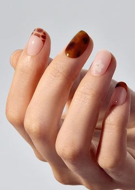 ohora N Tiki Tortoise nail strips application scene shows easy peel-and-stick.