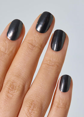 Close-up of Ohora N Boba Chrome strips during application for precise fit.
