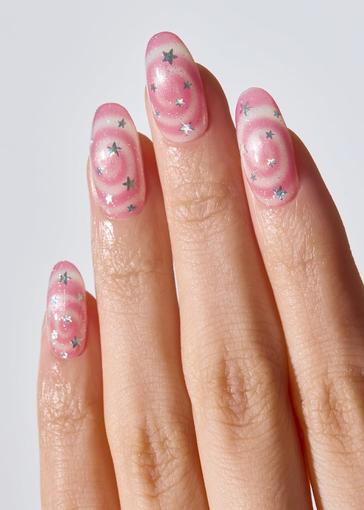 ohora N Candy Swirl collection in hand demonstrates flexible sizes for a perfect fit