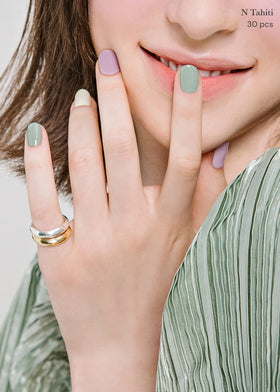 ohora N Tahiti strips on nails showing glossy finish and fit.