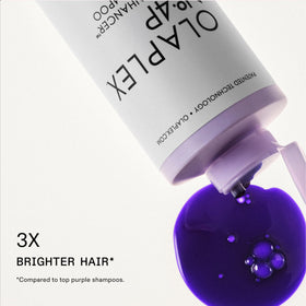 Olaplex Nº.4P purple-toning shampoo lather visible for cleansing and tone.