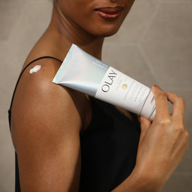 Olay application shot demonstrates hand and body use for quick moisturization