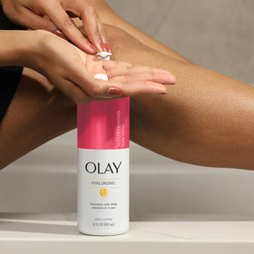 Olay lotion being rubbed into hands illustrates non-greasy, fast-absorbing hydration.